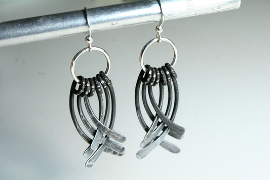 layered iron earings with 6 cascading pieces of iron hung from sterling silver ear wires