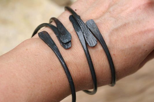 Set of three forged iron bangle bracelets. Hand forged black iron
