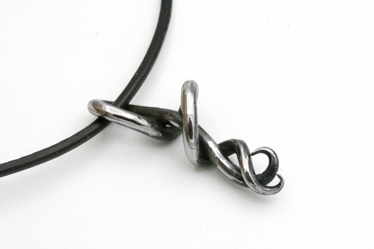 This one of a kind piece is part of my statement collection and is a perfect gift for a 6th wedding Anniversary. Iron symbolizes your unbreakable bond and strength. I carefully craft each pendant to create a beautiful flow. The metal is polished on the front to a beautiful chrome. I will never make another just like this. The pendant measures 2 inches long.