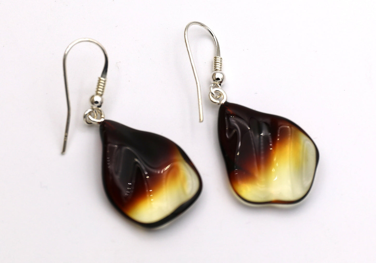 Amber earrings come with solid sterling silver ear wires.
The amber drops measures approximately 1 X 3/4 inches - very lightweight and perfect for everyday wear.