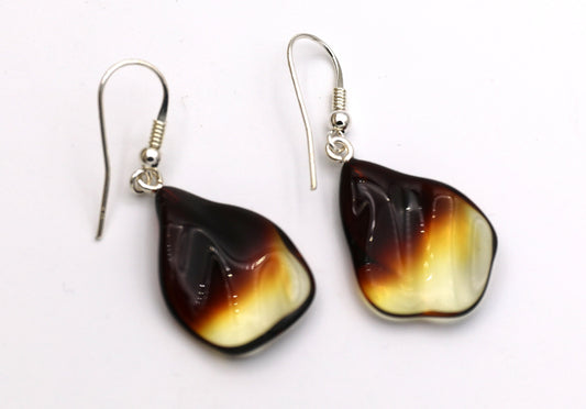 Amber earrings come with solid sterling silver ear wires.
The amber drops measures approximately 1 X 3/4 inches - very lightweight and perfect for everyday wear.