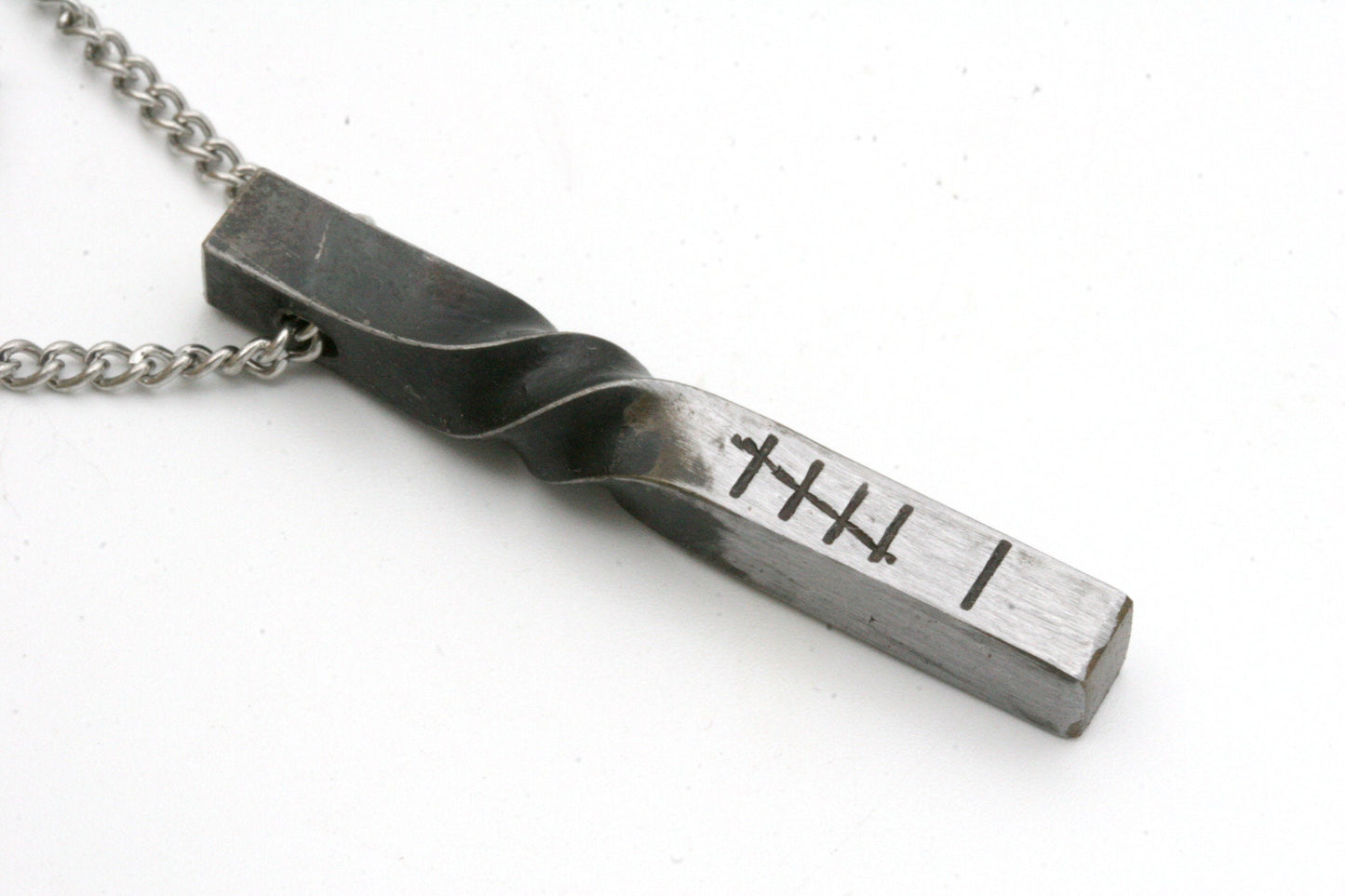 Commemorate your 6th wedding anniversary with this simple and modern pendant that is stamped with 6 tally marks. Show your love is as strong as Iron!

Made from solid iron, this pendant is drilled through the side to create a slider necklace. The pendant measure approximately 1 1/2 inches long.

You can choose from 16, 18, 20 or 24 inch necklace lengths.