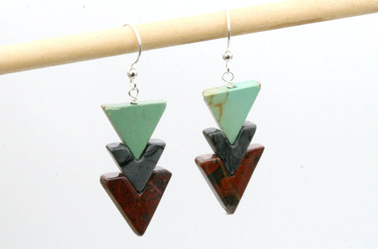 The long awaited and ever popular stone triangle earrings- These are made using incredibly rare vintage stone beads in a chevron cut. I have a limited amount of these beads so once they are gone thats it!

Robins egg blue genuine turquoise, grey jasper and red wine jasper triangles (incredibly earthy red) create these stunning earrings.
