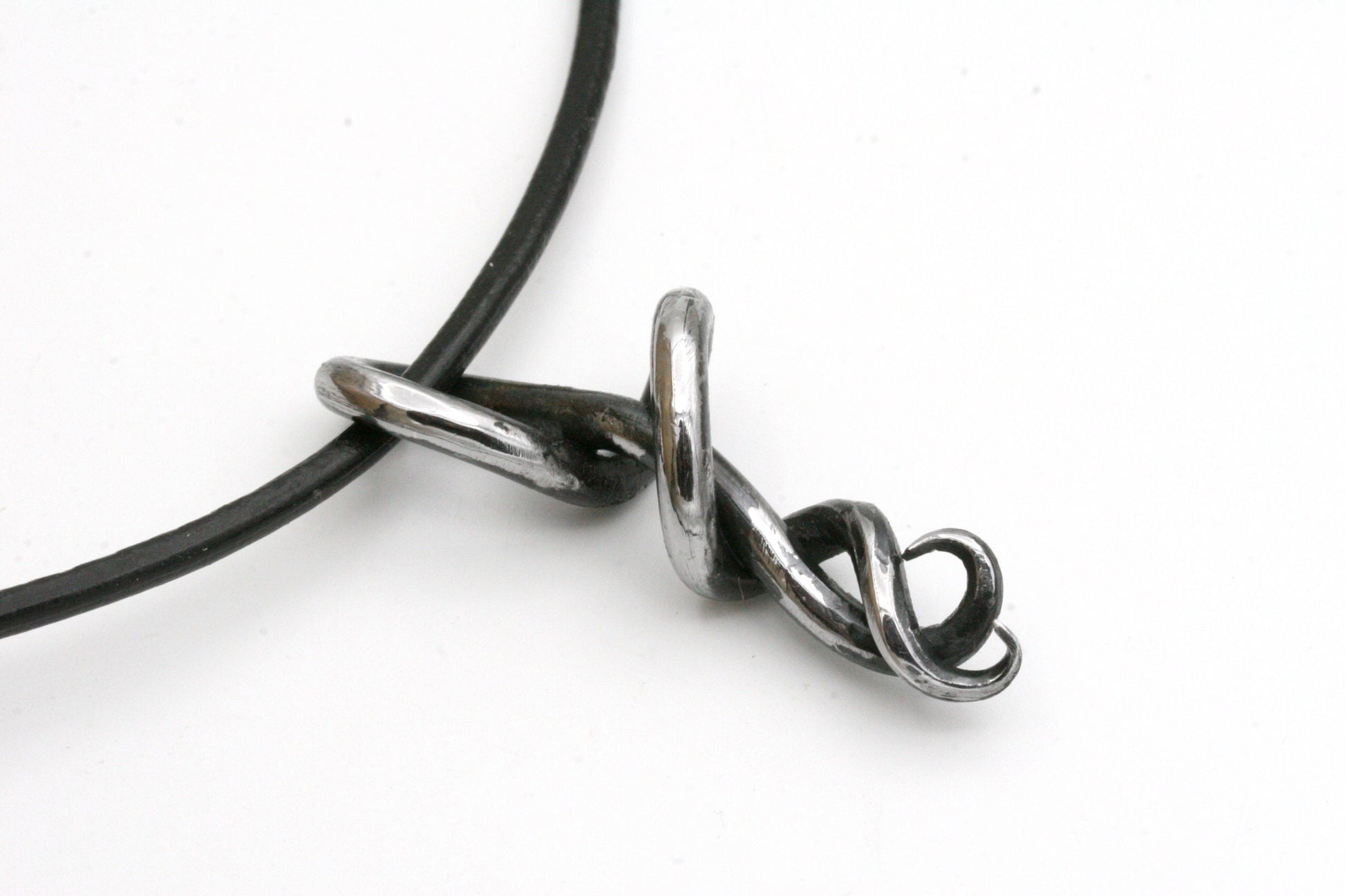 This one of a kind piece is part of my statement collection and is a perfect gift for a 6th wedding Anniversary. Iron symbolizes your unbreakable bond and strength. I carefully craft each pendant to create a beautiful flow. The metal is polished on the front to a beautiful chrome. I will never make another just like this. The pendant measures 2 inches long.